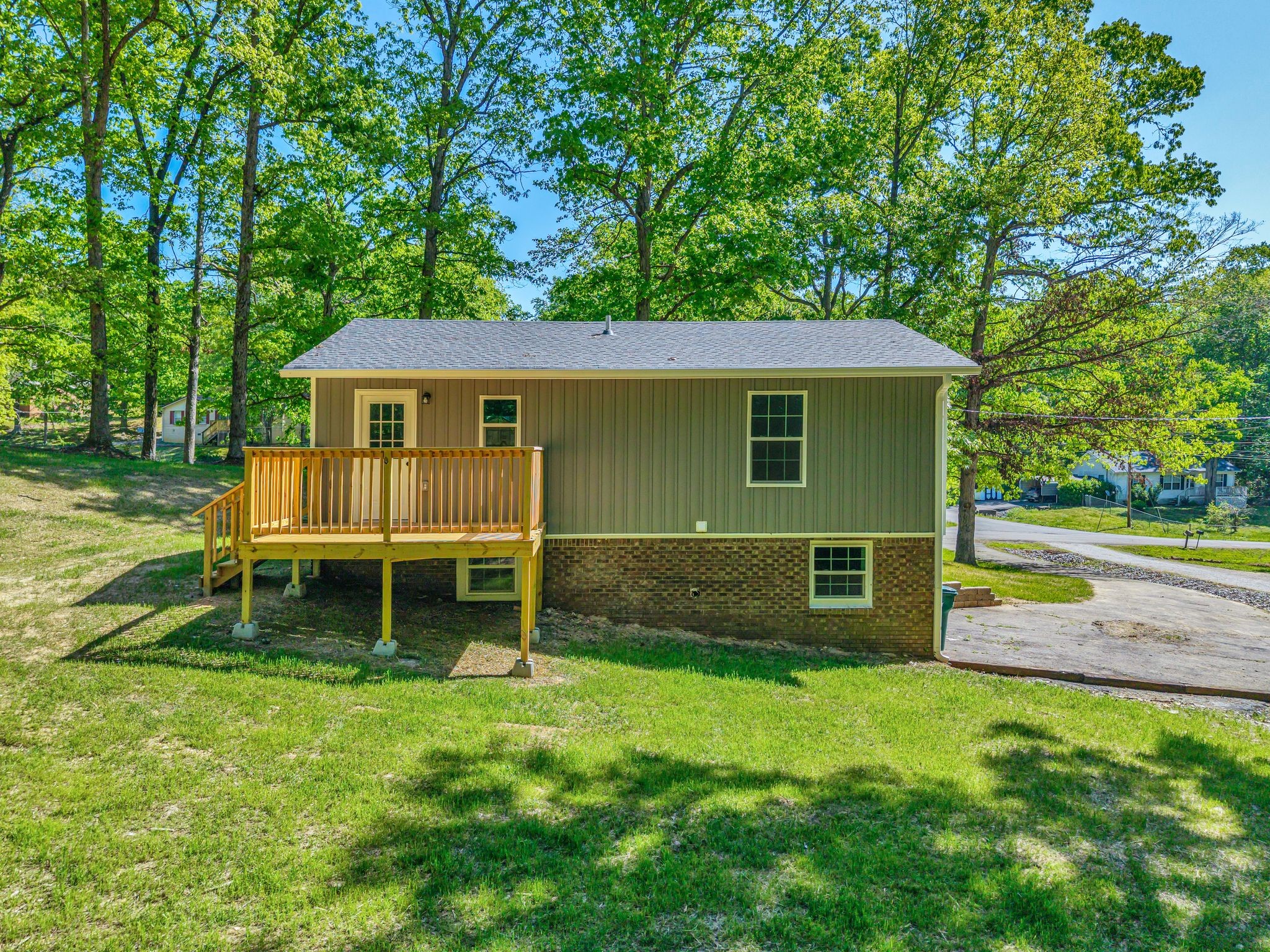 120 Bern Street Waverly, TN 37185 - Photo 33 of 36 a view of a house with a backyard