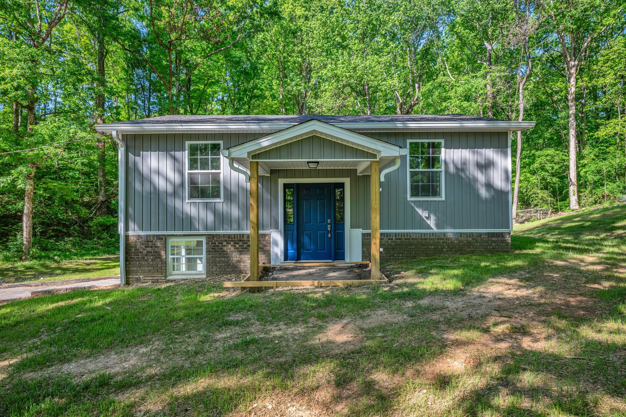 120 Bern Street Waverly, TN 37185 - Photo 4 of 36 a front view of a house with a garden