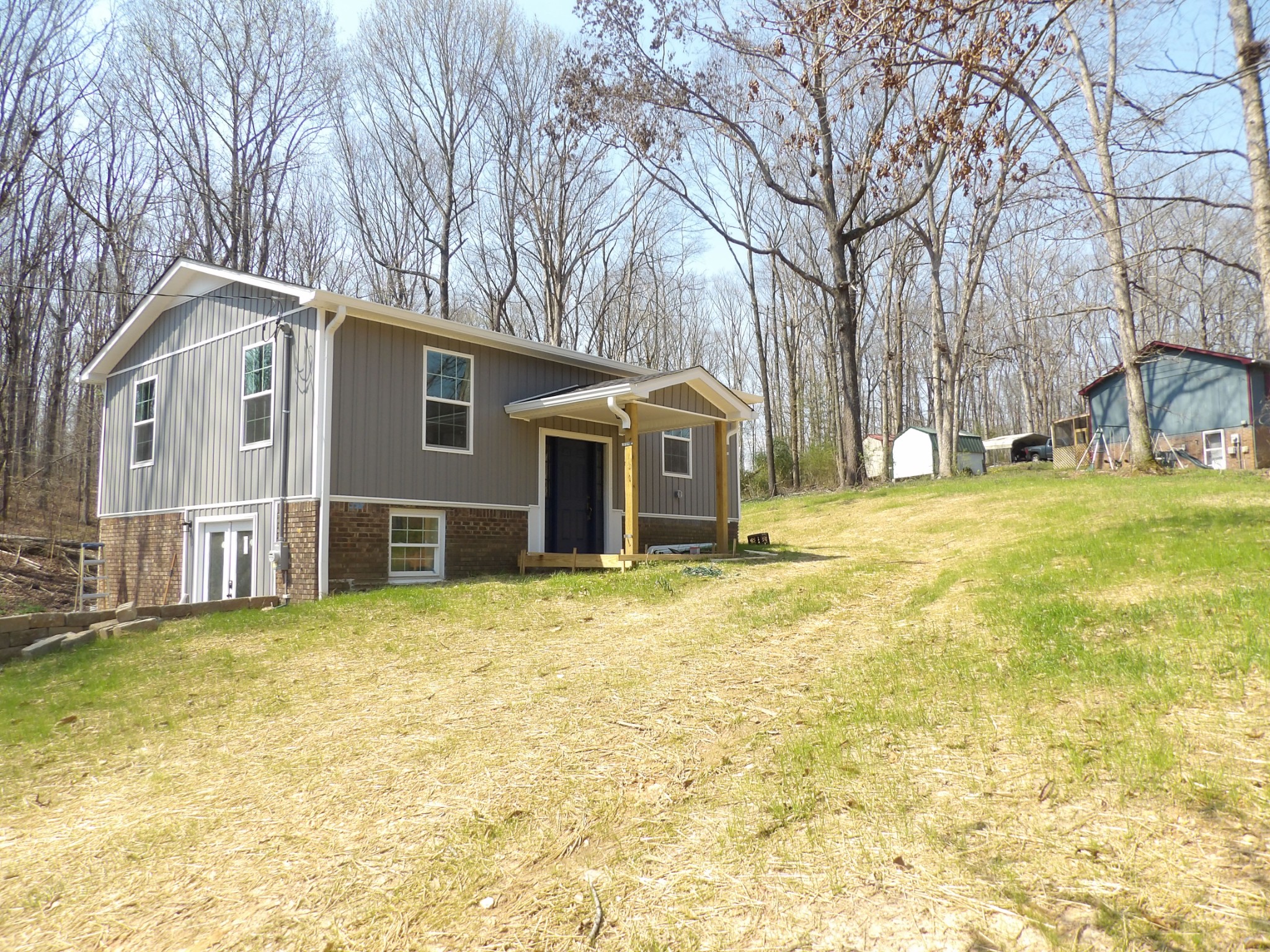 120 Bern Street Waverly, TN 37185 - Photo 5 of 36 a front view of a house with a yard