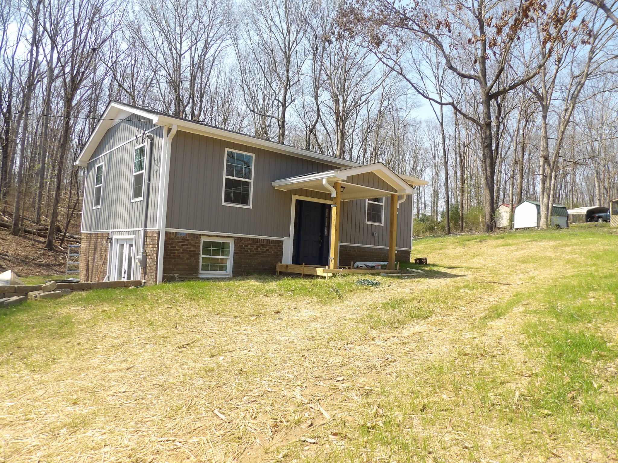 120 Bern Street Waverly, TN 37185 - Photo 7 of 36 a backyard of a house with large trees and covered with wooden fence