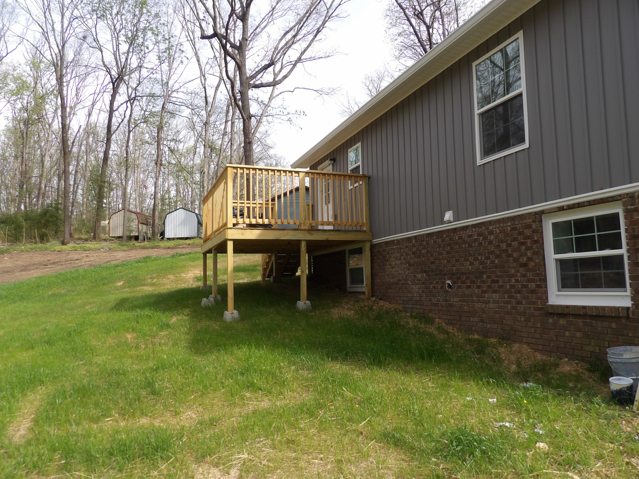 120 Bern Street Waverly, TN 37185 - Photo 9 of 36 a backyard of a house with table and chairs
