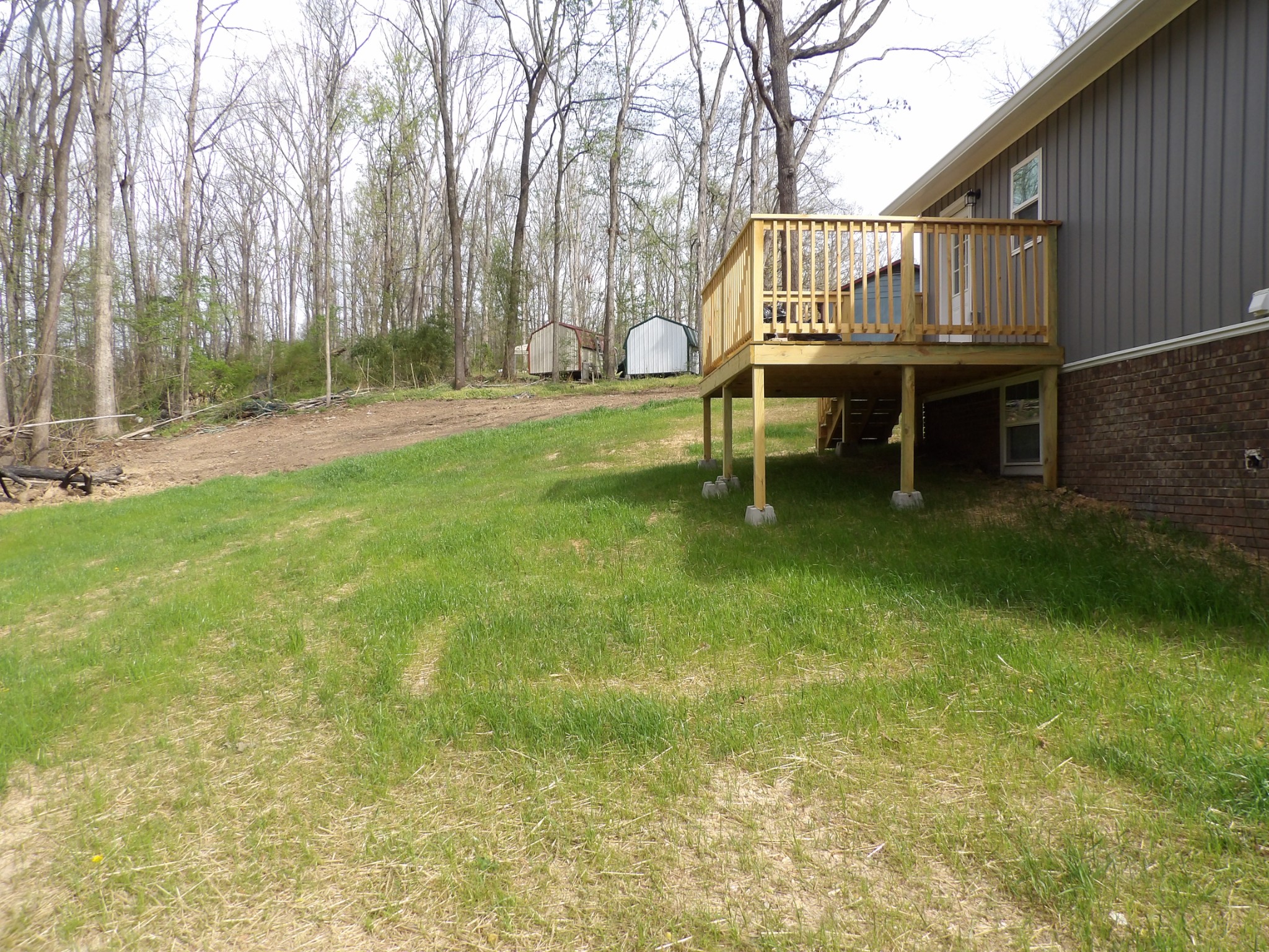 120 Bern Street Waverly, TN 37185 - Photo 10 of 36 a backyard of a house with table and chairs