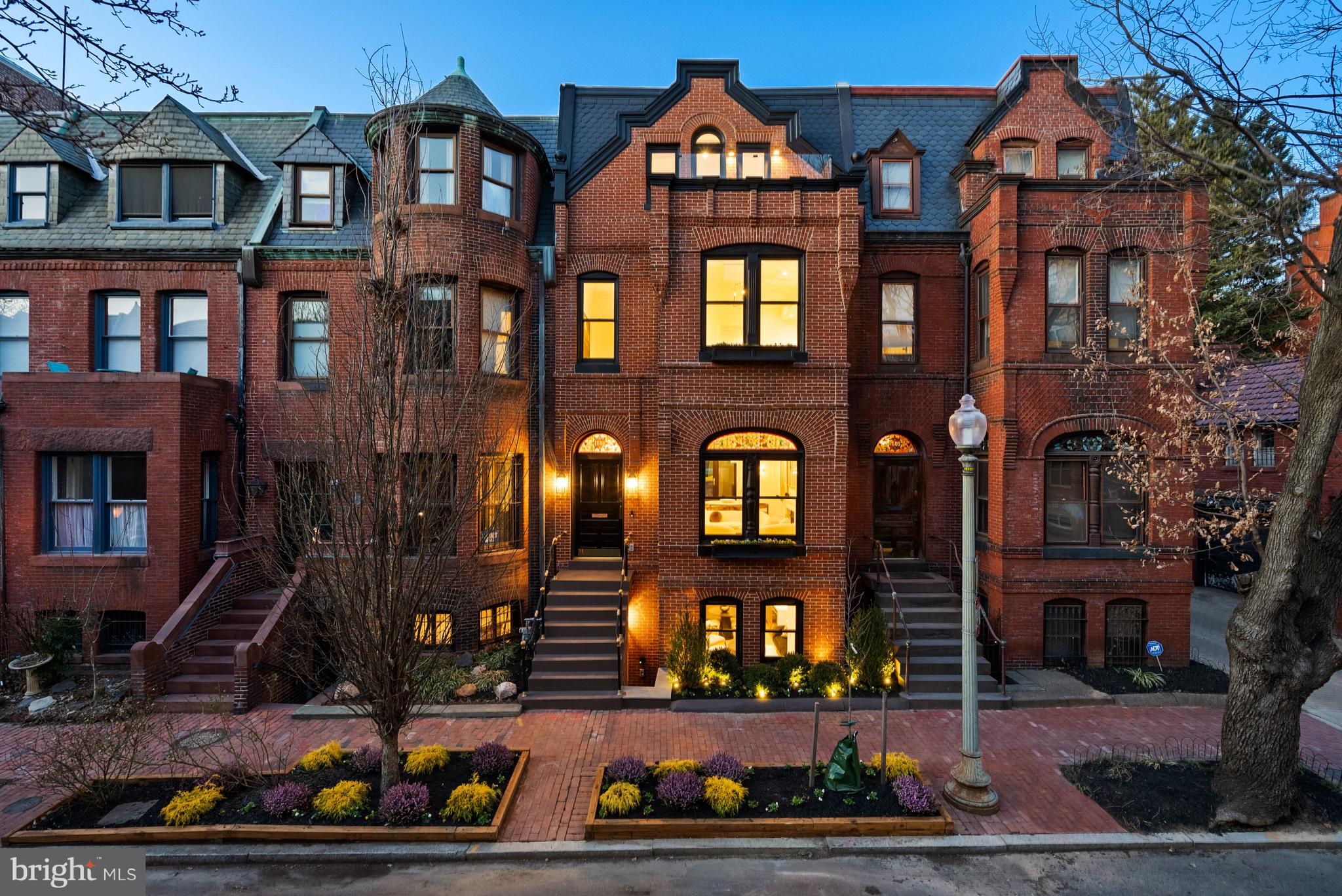 1611 Riggs Place Northwest Washington, DC 20009 - Photo 1 of 56 a front view of a brick building with many windows