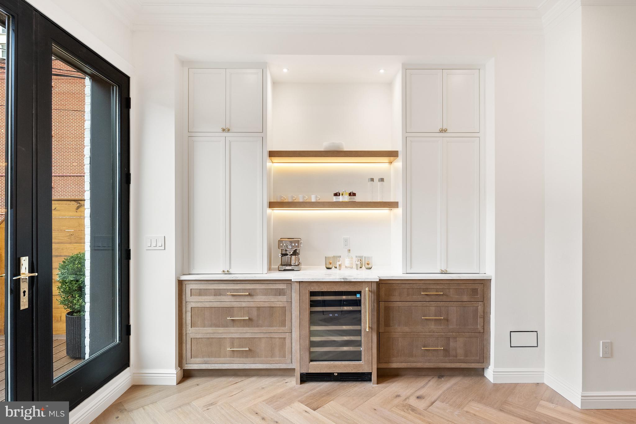 1611 Riggs Place Northwest Washington, DC 20009 - Photo 12 of 56 a room with cabinets and a dresser