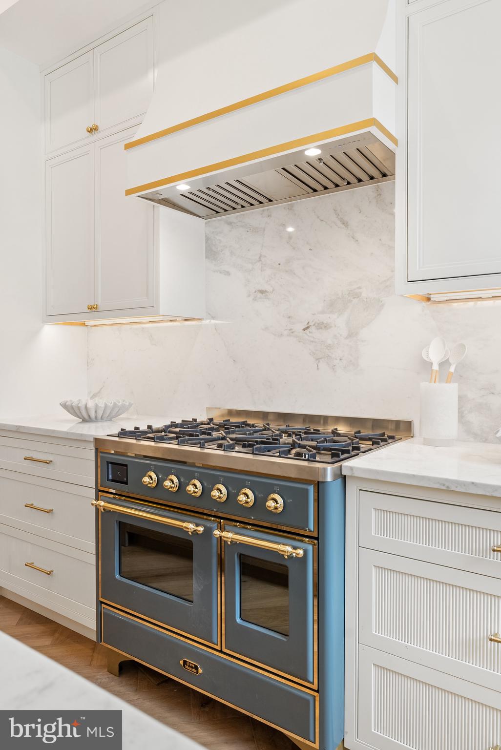 1611 Riggs Place Northwest Washington, DC 20009 - Photo 13 of 56 a stove top oven sitting inside of a kitchen