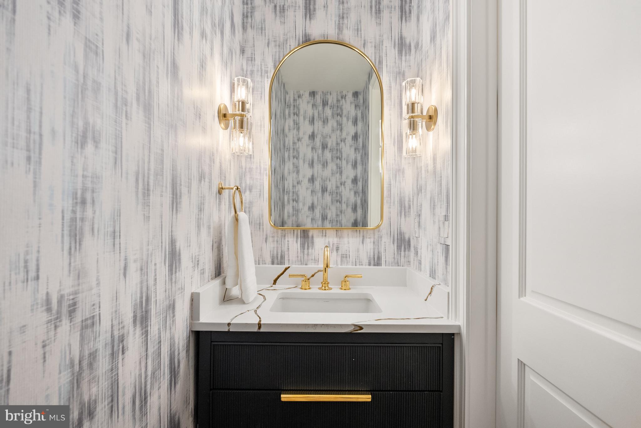1611 Riggs Place Northwest Washington, DC 20009 - Photo 15 of 56 a bathroom with a sink and a mirror