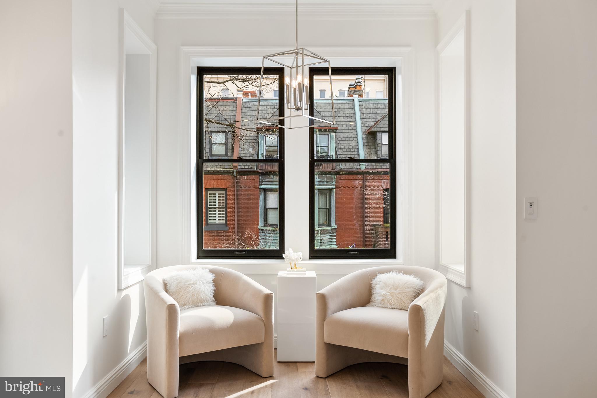 1611 Riggs Place Northwest Washington, DC 20009 - Photo 19 of 56 a living room with furniture and a large window