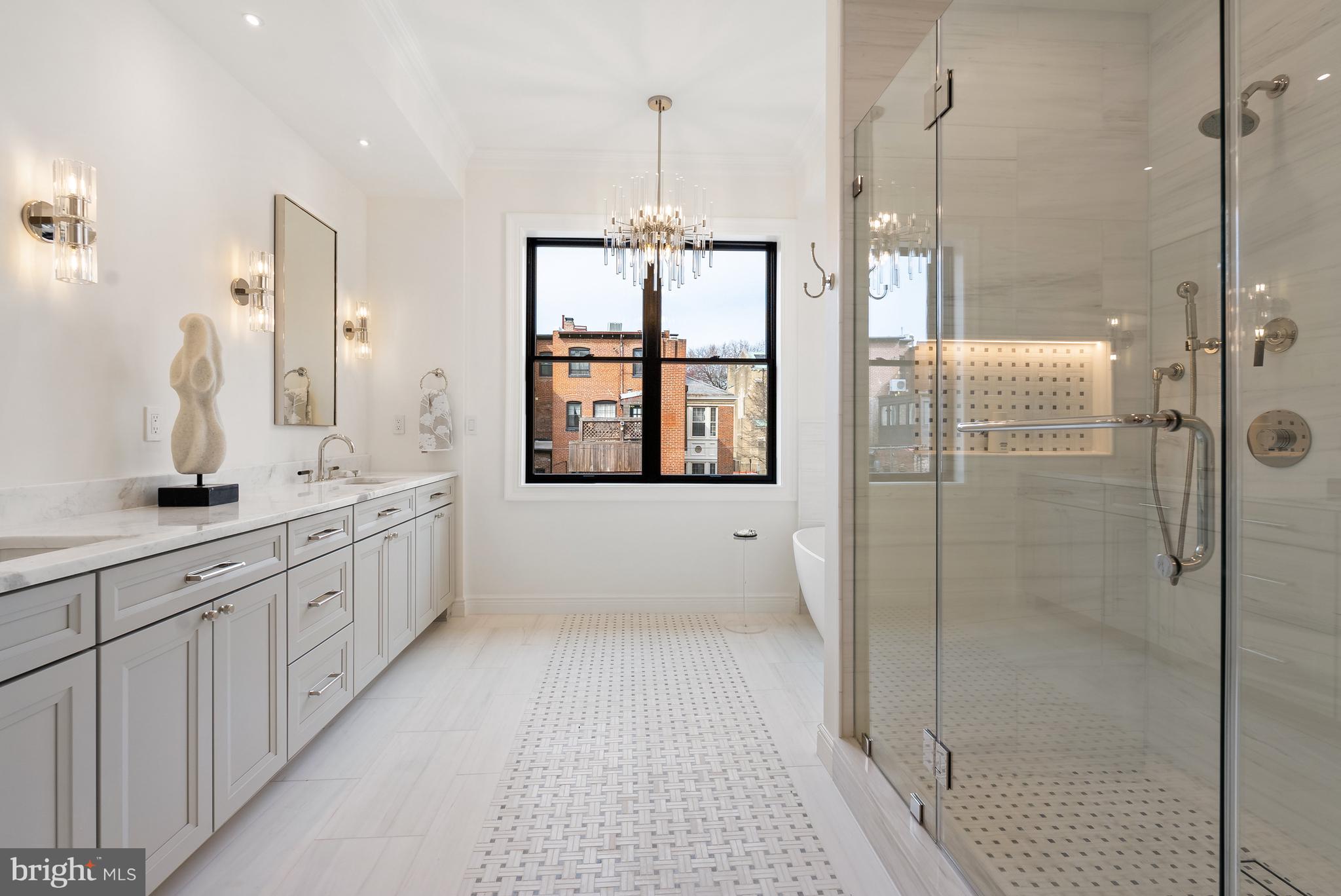 1611 Riggs Place Northwest Washington, DC 20009 - Photo 22 of 56 a bathroom with a double vanity sink mirror and shower