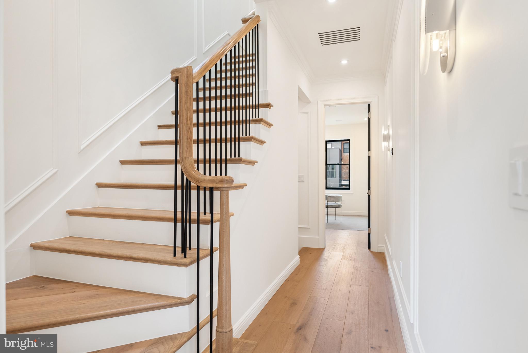 1611 Riggs Place Northwest Washington, DC 20009 - Photo 27 of 56 a view of a hallway with wooden floor and entryway