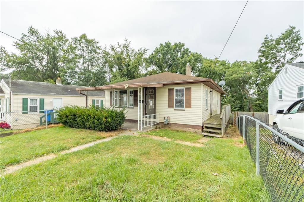 406 Violet Drive Lower Burrell, PA 15068 - Photo 3 of 15 a front view of a house with a yard