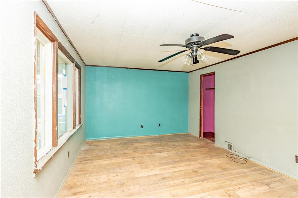 406 Violet Drive Lower Burrell, PA 15068 - Photo 4 of 15 a view of a room with a ceiling fan and a window