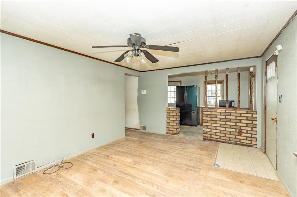 406 Violet Drive Lower Burrell, PA 15068 - Photo 6 of 15 a view of a hallway with wooden shelves