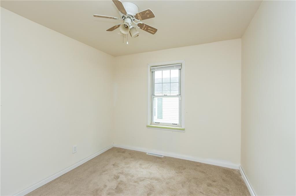 406 Violet Drive Lower Burrell, PA 15068 - Photo 10 of 15 an empty room with windows and fan