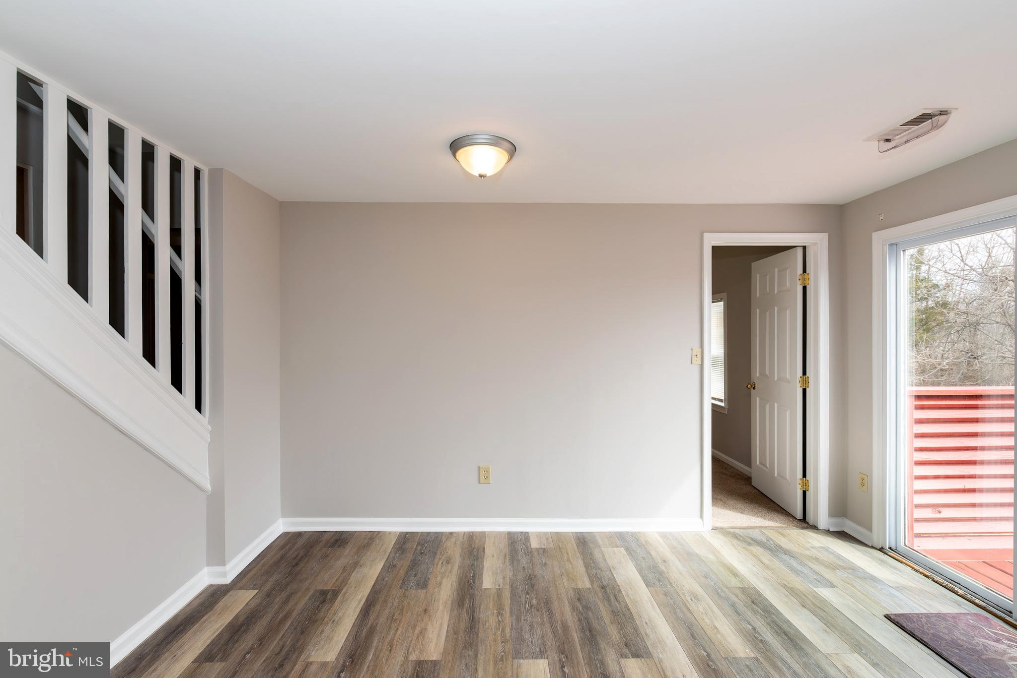 117 Quaker Neck Road Salem, NJ 08079 - Photo 33 of 51 wooden floor in an empty room with a window