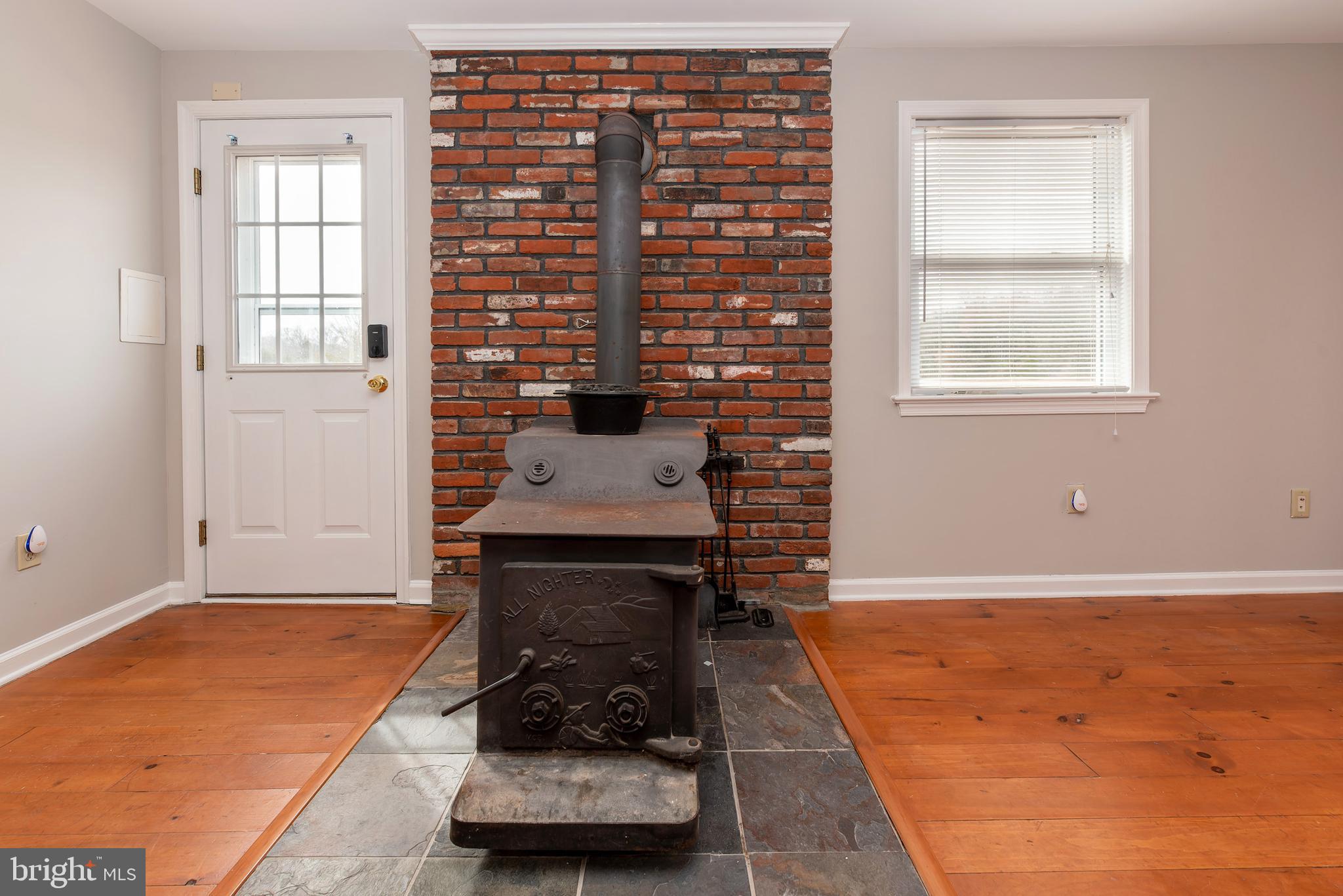 117 Quaker Neck Road Salem, NJ 08079 - Photo 36 of 51 a living room with furniture and a fireplace