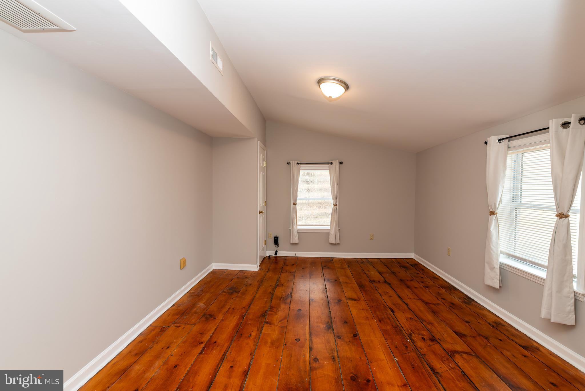 117 Quaker Neck Road Salem, NJ 08079 - Photo 40 of 51 a view of empty room with wooden floor and fan