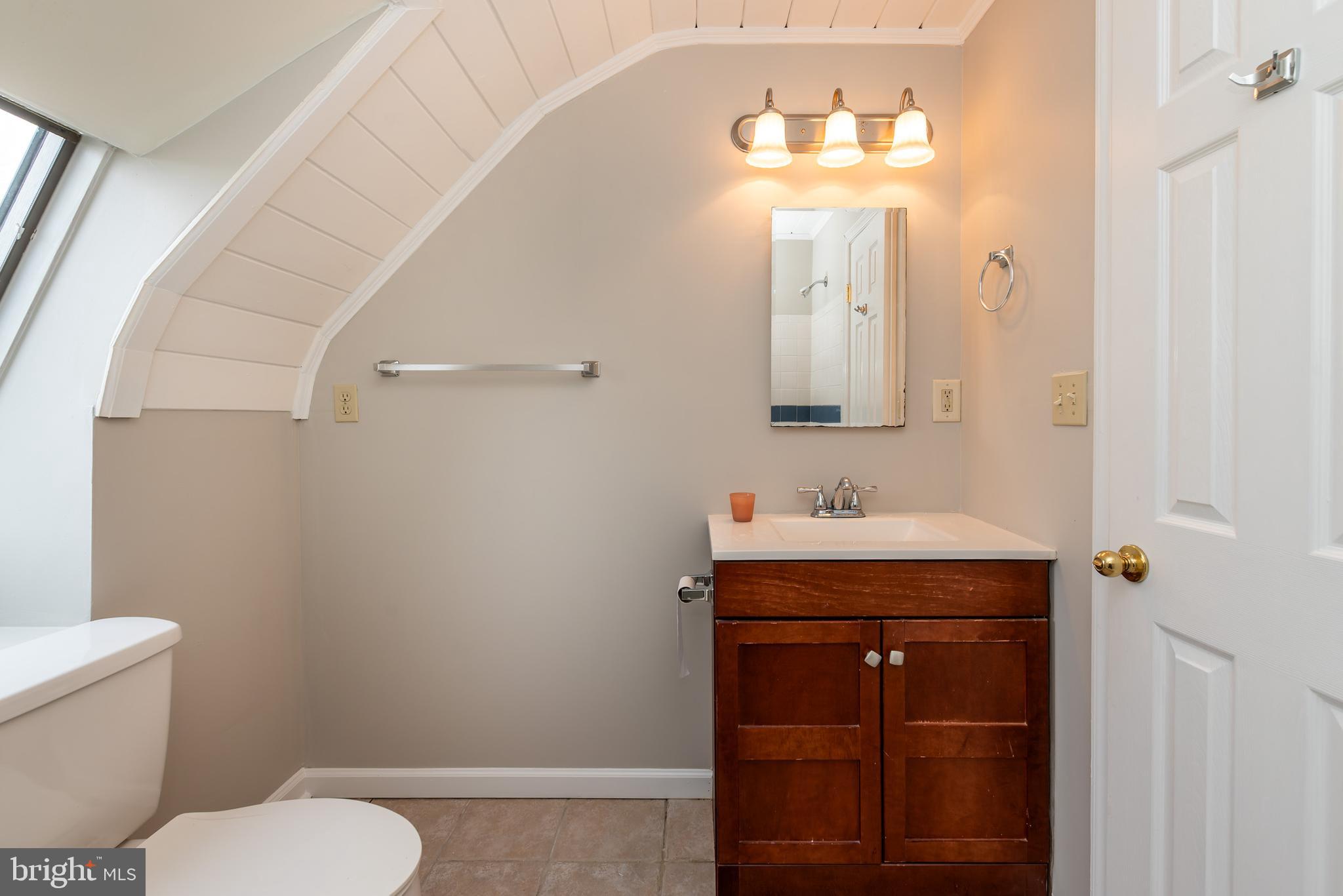 117 Quaker Neck Road Salem, NJ 08079 - Photo 49 of 51 a bathroom with a sink a toilet and mirror