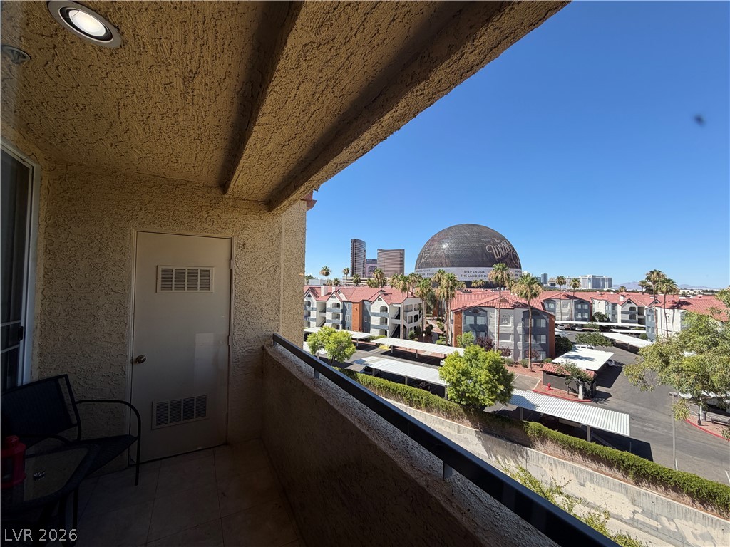 210 East Flamingo Road, Unit 426 Las Vegas, NV 89169 - Photo 8 of 17 A private balcony offers a vantage point overlooking the vibrant city landscape and surrounding community.