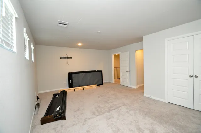 a bathroom with a sink a toilet a mirror and shower