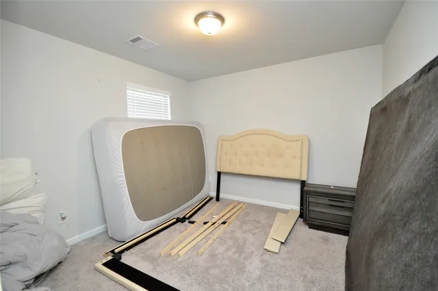 a kitchen with a refrigerator and a stove