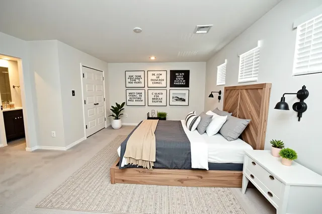 a bedroom with a bed and window