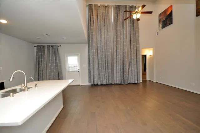 a spacious bathroom with a double vanity sink and a mirror
