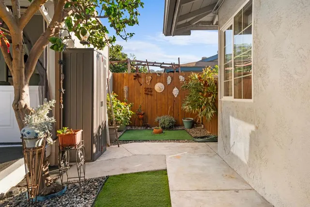 a view of a porch with potted plants