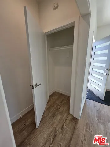 an empty room with wooden floor