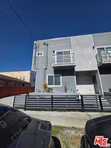a view of a patio with a table and chairs