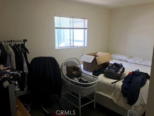 a bedroom with a workspace