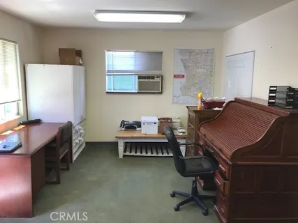 a room with a cabinets and a flat screen tv