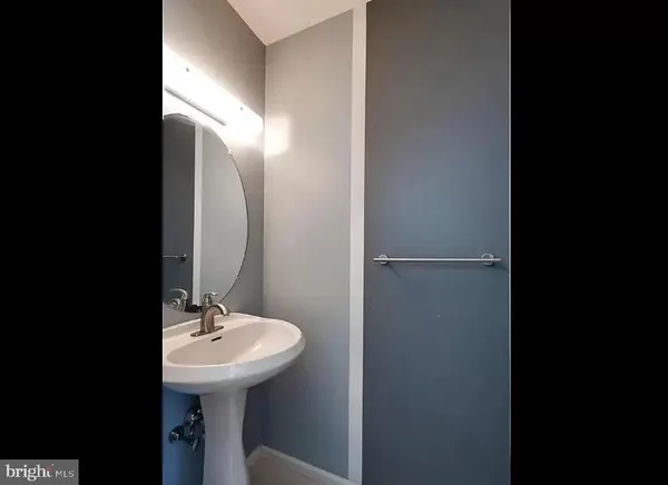 a bathroom with a sink and mirror