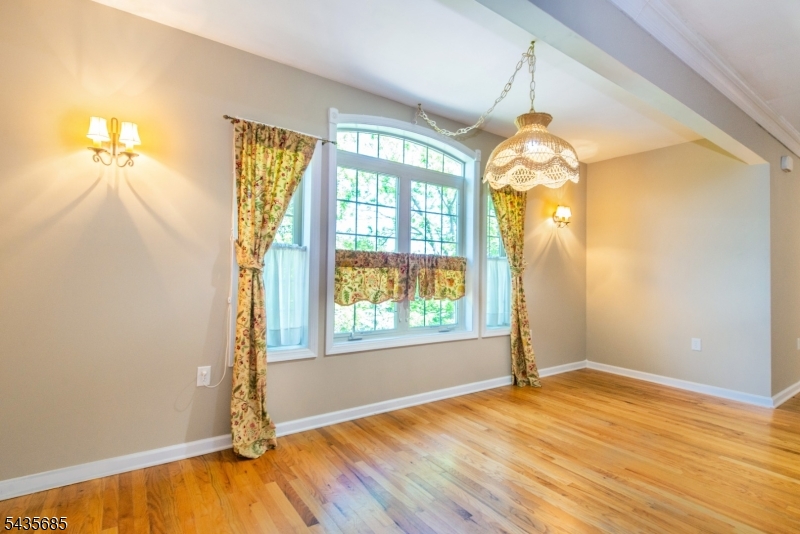 16 Main Street Sparta, NJ 07871 - Photo 15 of 33 an empty room with wooden floor and windows