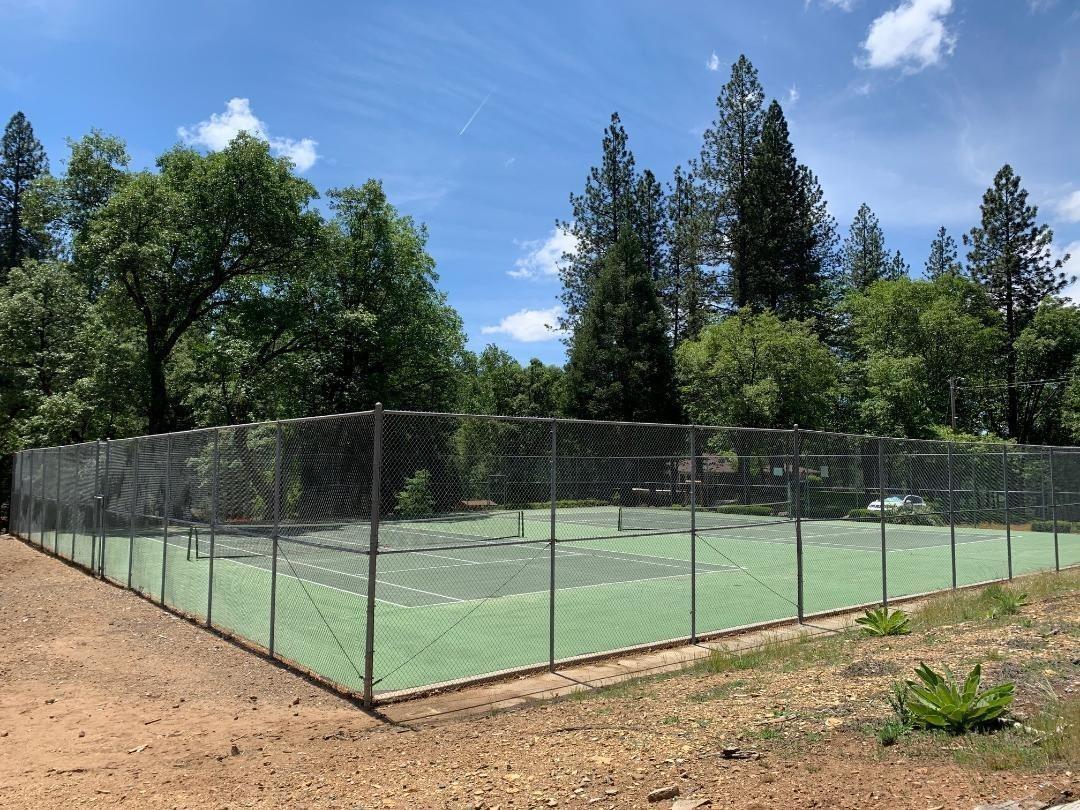 5511 Shooting Star Road Pollock Pines, CA 95726 - Photo 18 of 18 a view of a backyard with fence