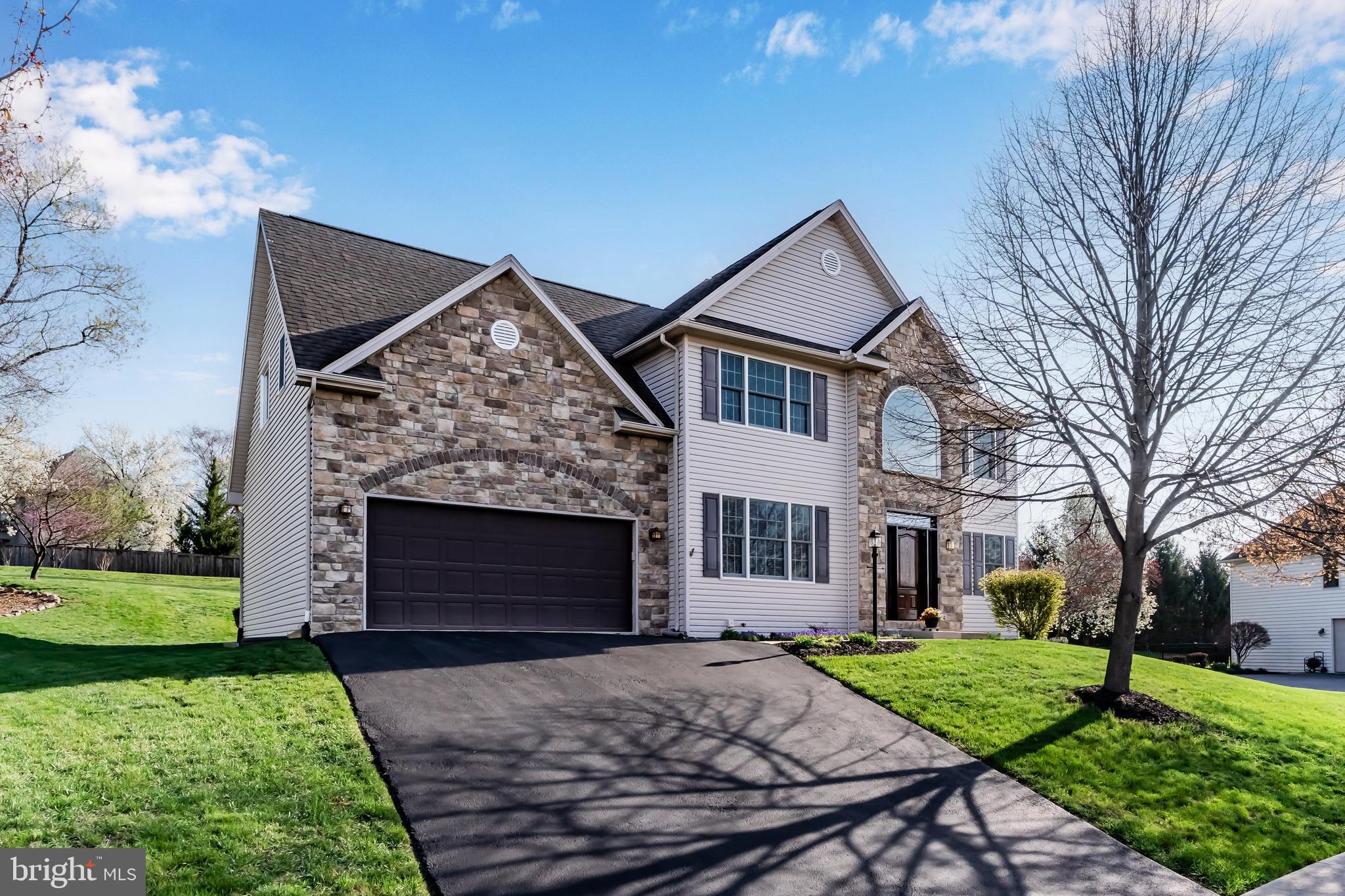 8 Bayberry Road Carlisle, PA 17013 - Photo 2 of 9 a front view of a house with a yard and garage