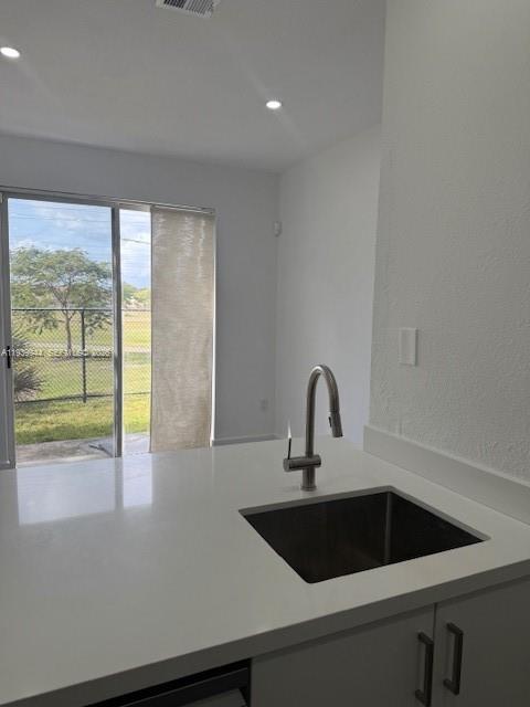 17820 Northwest 73rd Avenue, Unit 1011 Hialeah, FL 33015 - Photo 11 of 11 a close view of a sink a counter space and a sink