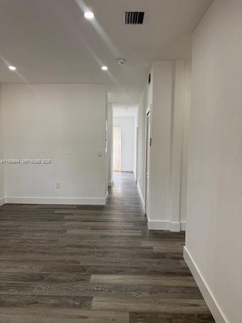 17820 Northwest 73rd Avenue, Unit 1011 Hialeah, FL 33015 - Photo 3 of 11 a view of an empty room with wooden floor