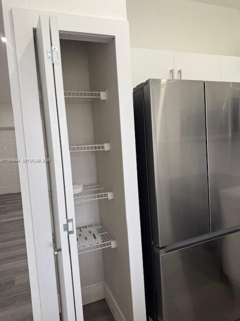 17820 Northwest 73rd Avenue, Unit 1011 Hialeah, FL 33015 - Photo 9 of 11 a view of walk in closet with empty racks