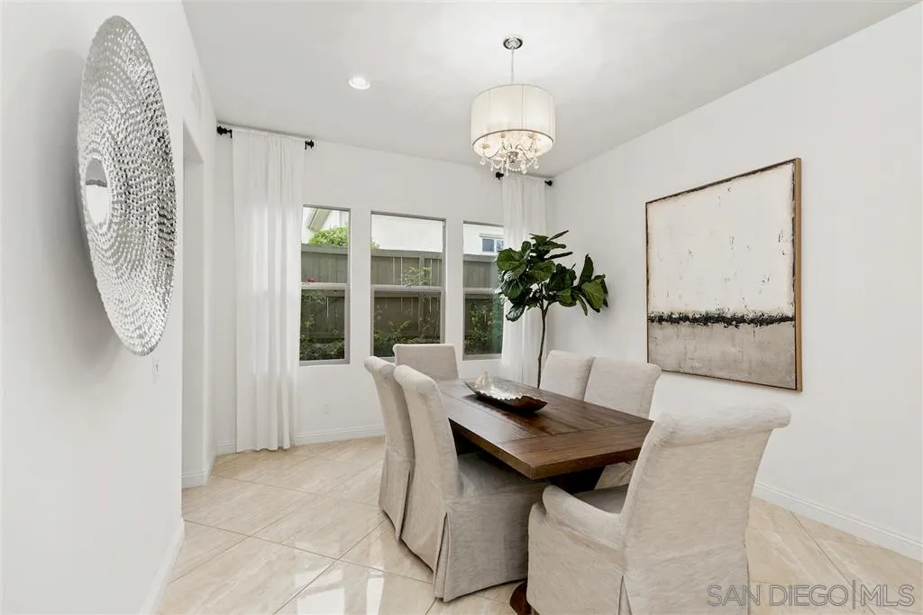 15536 Tanner Ridge Road San Diego, CA 92127 - Photo 4 of 25 a view of a dining room with furniture and chandelier