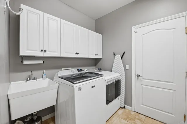 a view of a hallway with a dining table & chairs