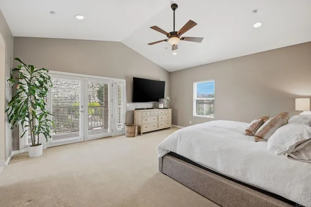 a white bath tub sitting in front of a window