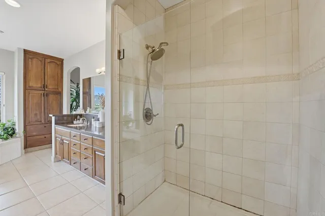 a garden with a bench and palm trees