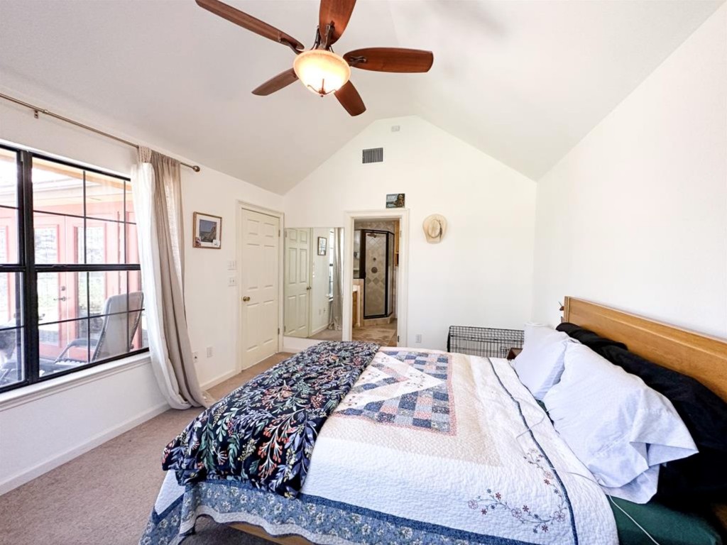 251 Pine View Loop Bastrop, TX 78602 - Photo 15 of 30 a bedroom with a large bed and a large window
