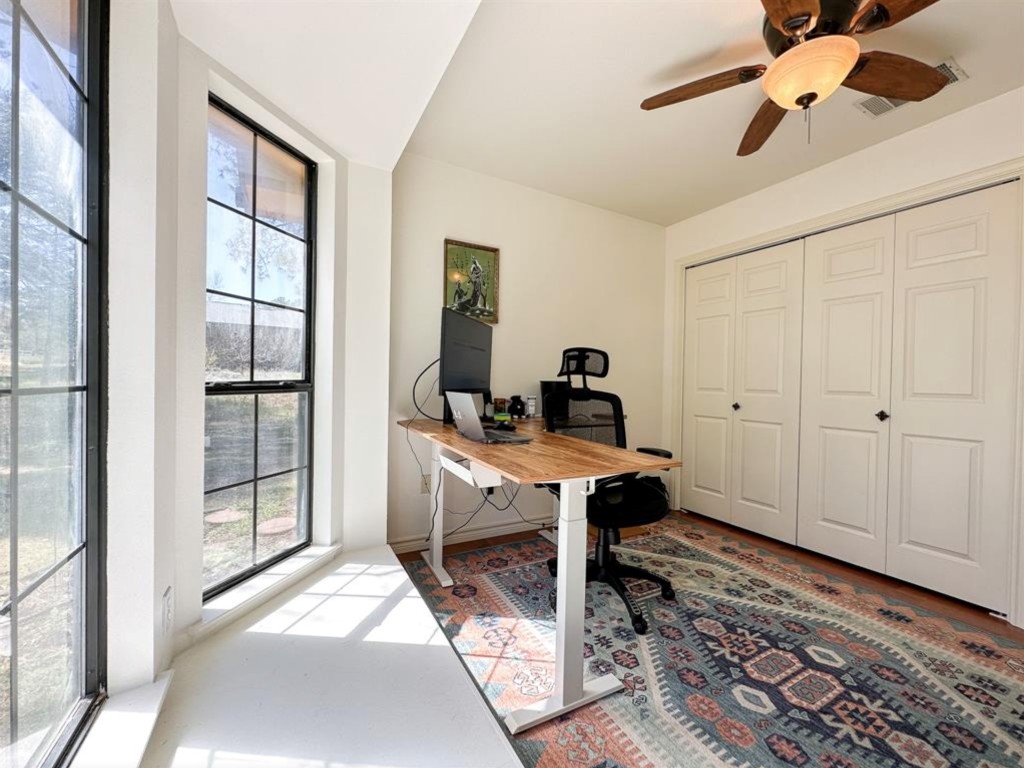 251 Pine View Loop Bastrop, TX 78602 - Photo 17 of 30 a view of a workspace with furniture and a window