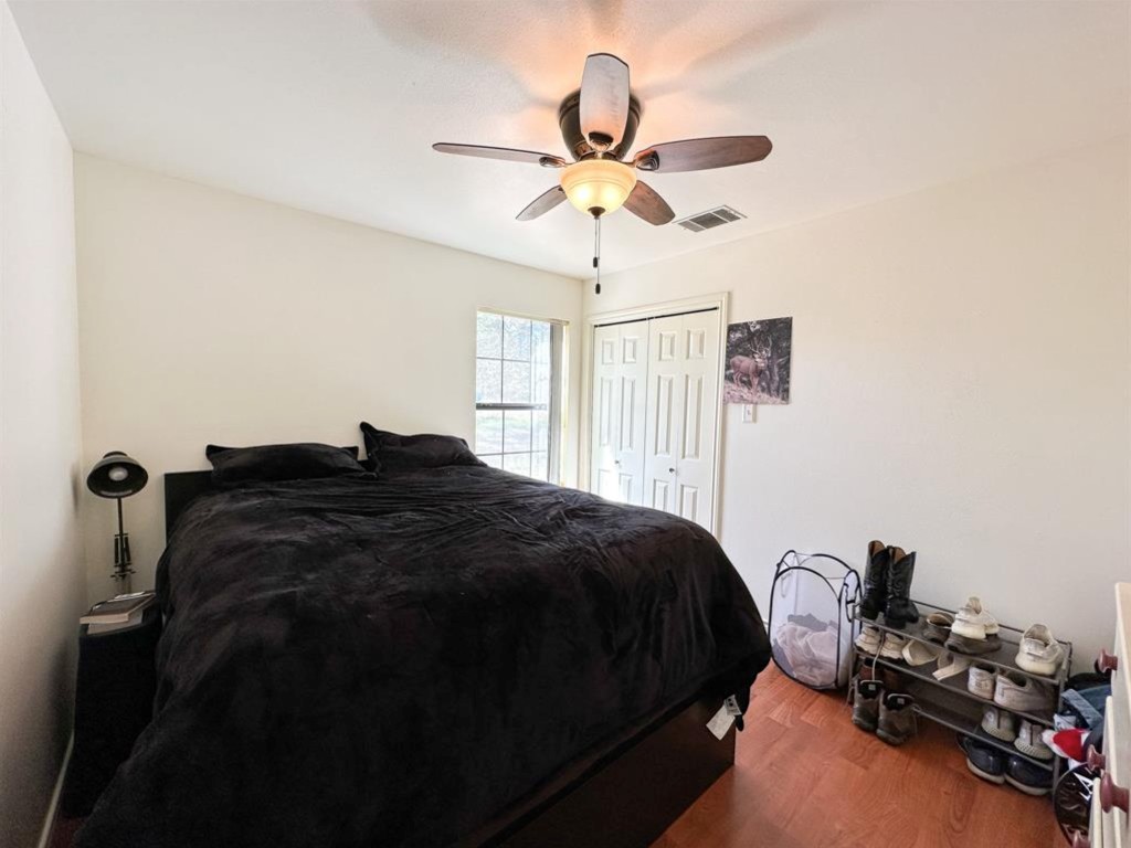 251 Pine View Loop Bastrop, TX 78602 - Photo 19 of 30 a bedroom with a bed and a window