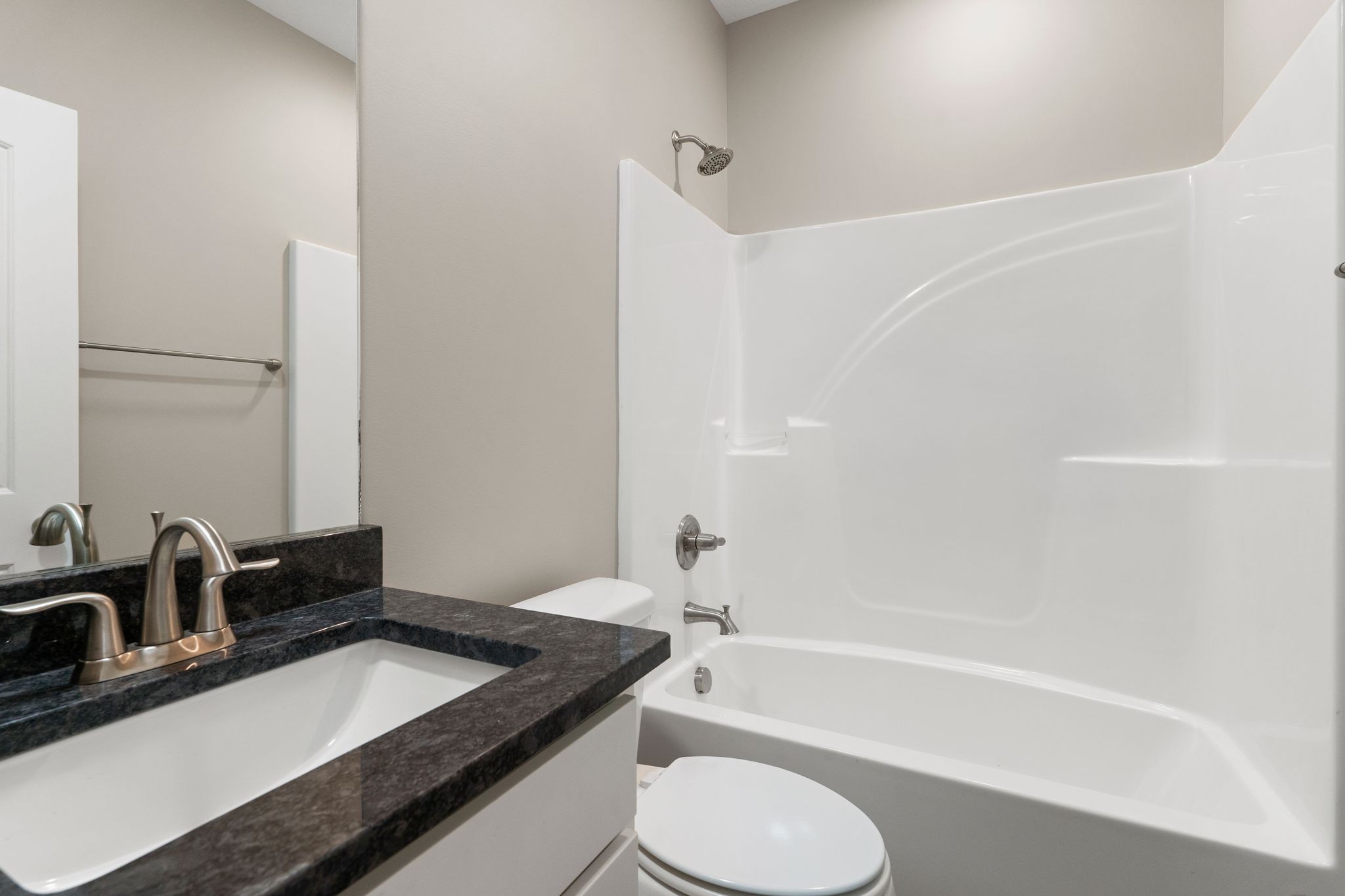 803 Shepard Street South Winchester, TN 37398 - Photo 27 of 33 a bathroom with a granite countertop sink toilet and shower