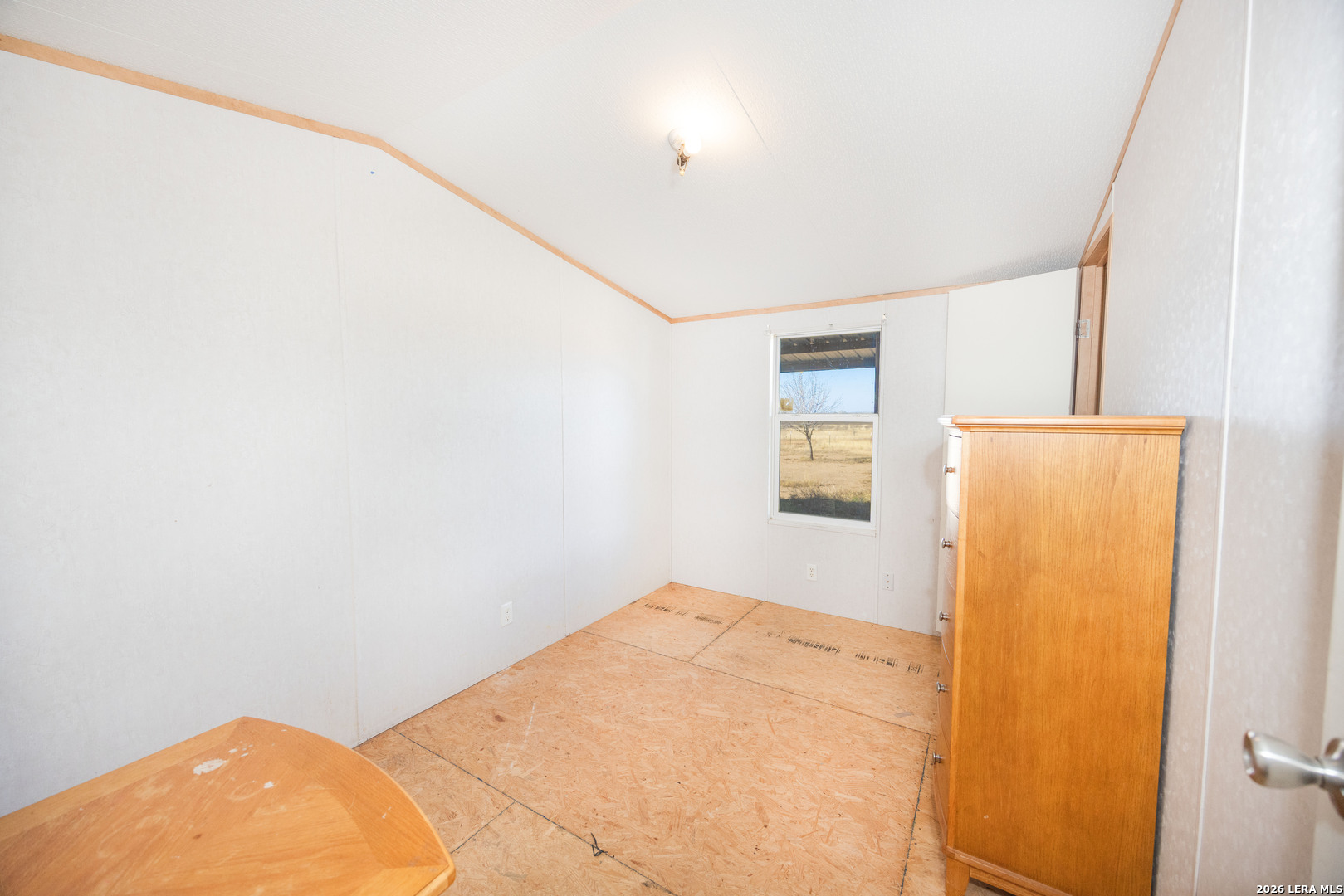 4919 County Road 545 Devine, TX 78016 - Photo 11 of 38 a view of a bedroom with closet