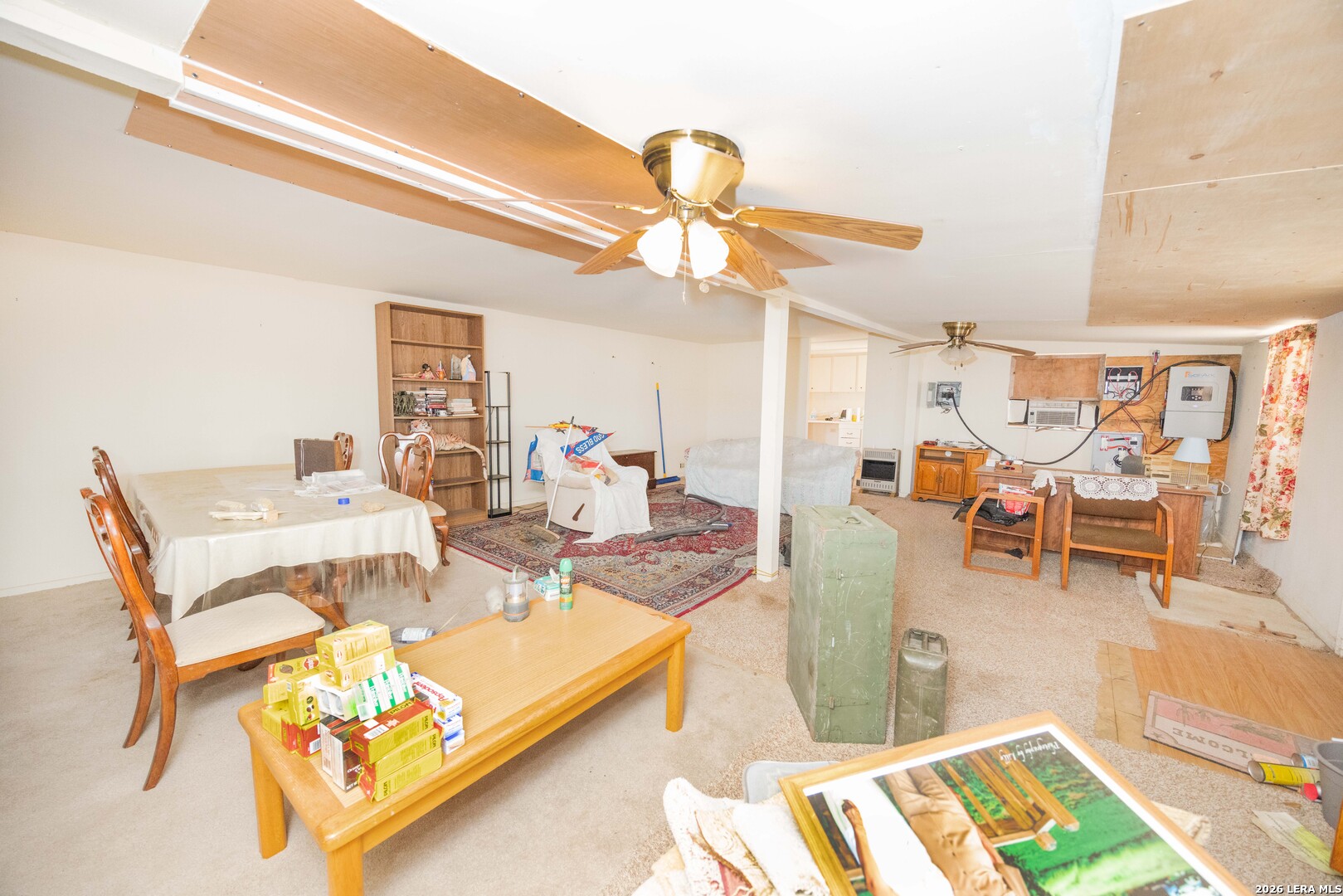 4919 County Road 545 Devine, TX 78016 - Photo 14 of 38 a view of a dining room with furniture and a rug