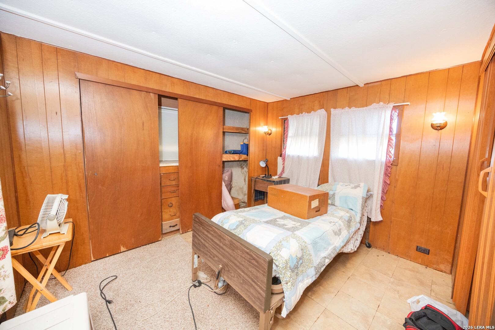 4919 County Road 545 Devine, TX 78016 - Photo 16 of 38 a bedroom with a bed and wooden floor
