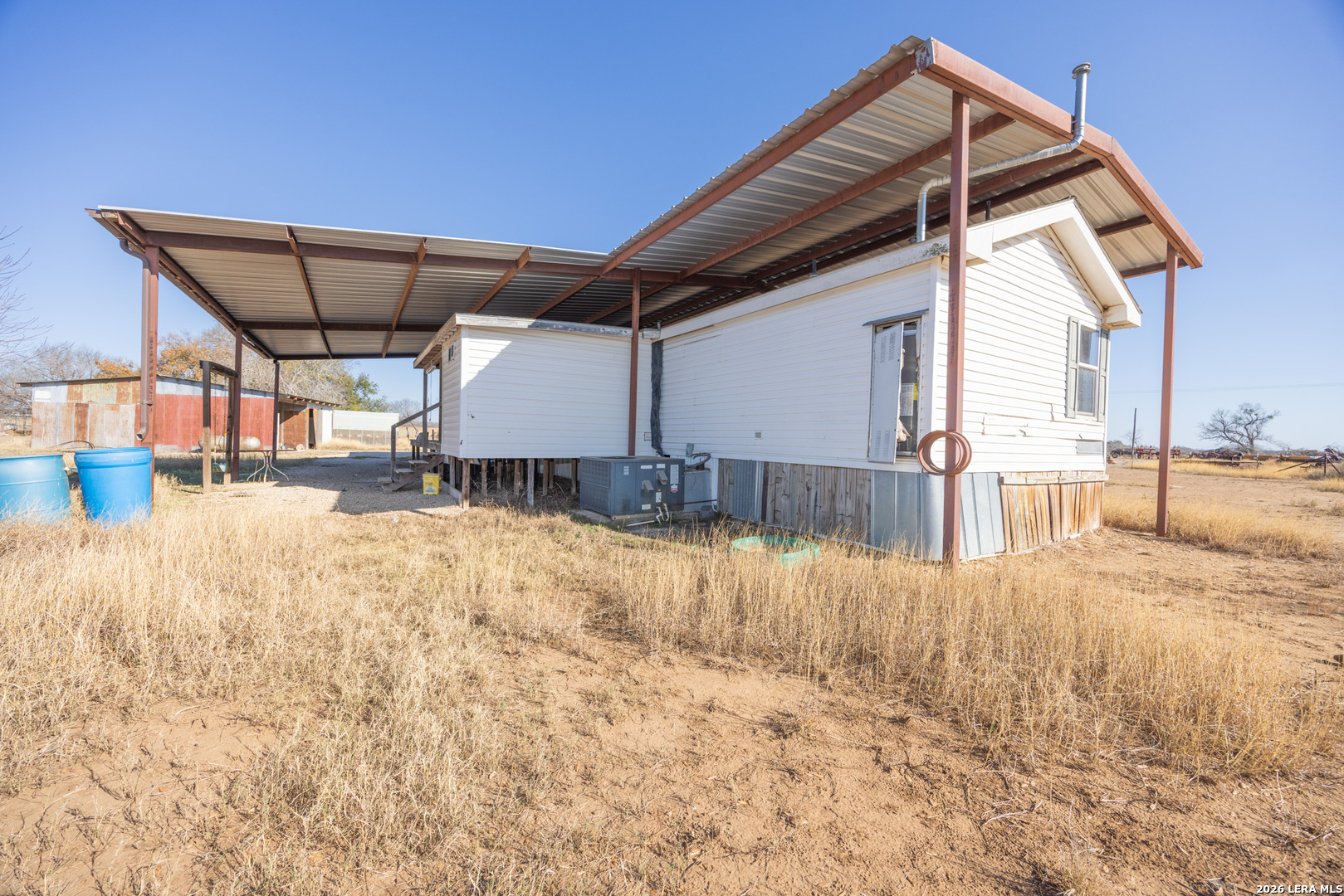 4919 County Road 545 Devine, TX 78016 - Photo 20 of 38 a house view with a outdoor space